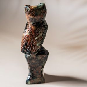 Handcrafted stone owl sculpture detailed carving rear view