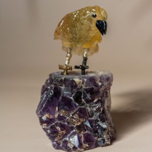 Close-up of hand carved stone bird detailing and polished texture