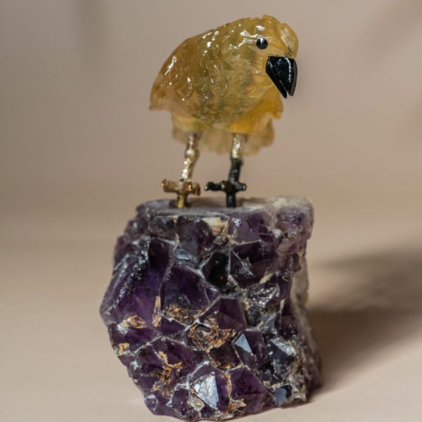 Close-up of hand carved stone bird detailing and polished texture