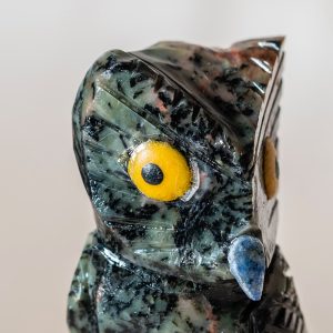 Close up detail of semi precious stone owl sculpture craftsmanship