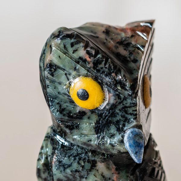 Close up detail of semi precious stone owl sculpture craftsmanship
