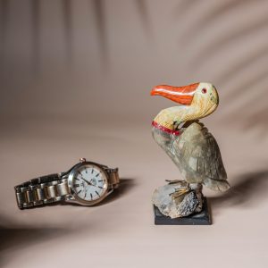 Pelican stone sculpture on natural crystal base for home decor