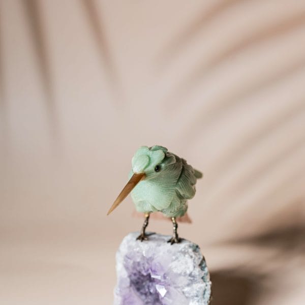 Green calcite bird figurine on natural amethyst crystal base for luxury home decor and gifting