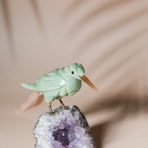 Green calcite bird figurine on natural amethyst crystal base for luxury home decor and gifting