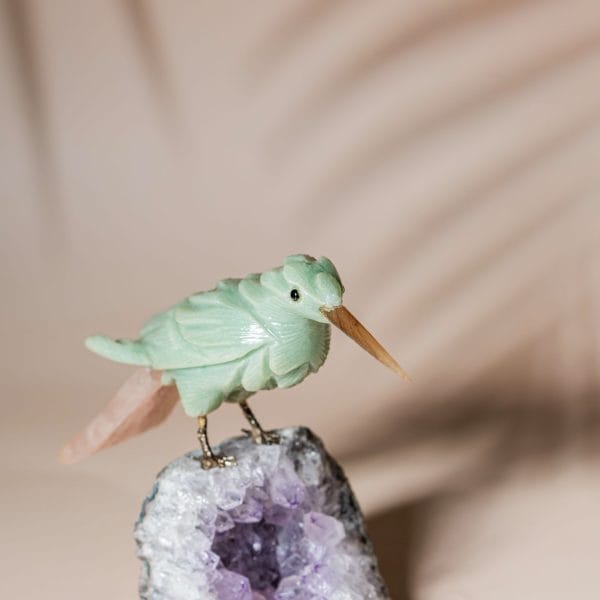 Green calcite bird figurine on natural amethyst crystal base for luxury home decor and gifting