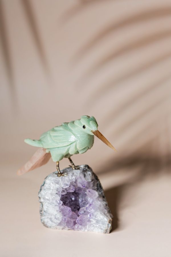 Green calcite bird figurine on natural amethyst crystal base for luxury home decor and gifting