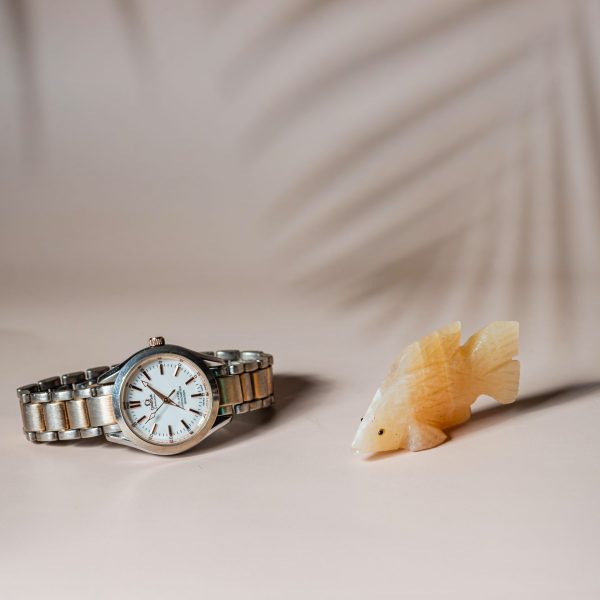 Honey calcite fish figurine made from semi-precious stone for home decor and gifting