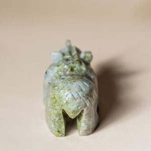 Back view of handcrafted jade bear sculpture showing smooth stone carving