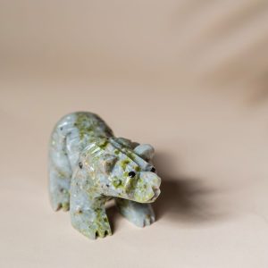 Handcrafted light green jade bear sculpture with natural stone texture for home decor