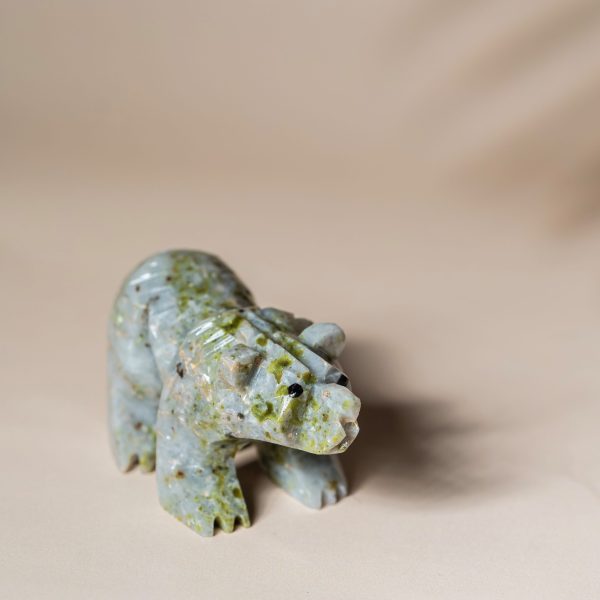 Handcrafted light green jade bear sculpture with natural stone texture for home decor
