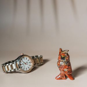 Orange calcite owl figurine made from semi-precious stone for home decor and gifting