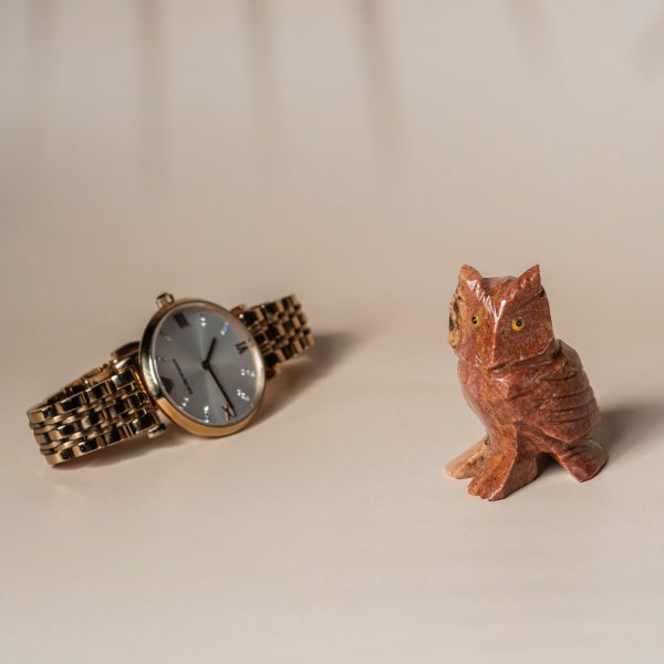 Orange calcite owl figurine made from semi-precious stone for home decor and gifting