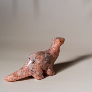 Handcrafted pink granite dinosaur figurine made from semi precious stone