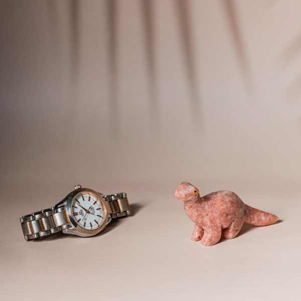 Handcrafted pink granite dinosaur figurine made from semi precious stone