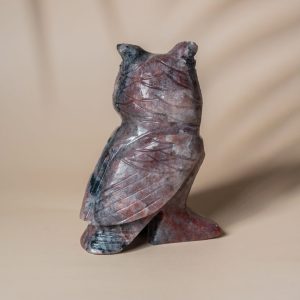 Back view of handcrafted purple jasper owl stone sculpture