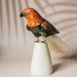 Semi precious stone parrot sculpture with orange calcite head and green aventurine body