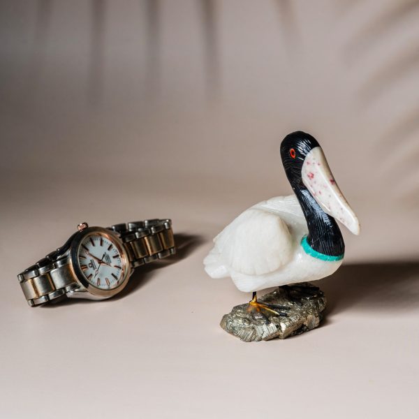 White onyx pelican figurine handcrafted from semi precious stone on natural pyrite base