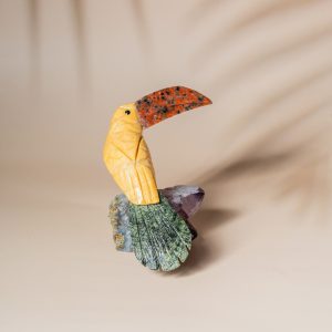 Yellow calcite pelican bird figurine handcrafted from semi precious stones on amethyst base