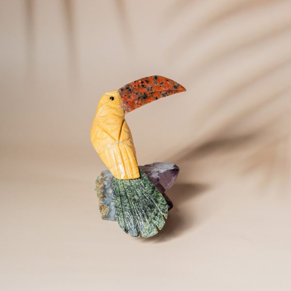 Yellow calcite pelican bird figurine handcrafted from semi precious stones on amethyst base