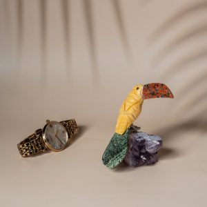 Yellow calcite pelican bird figurine handcrafted from semi precious stones on amethyst base